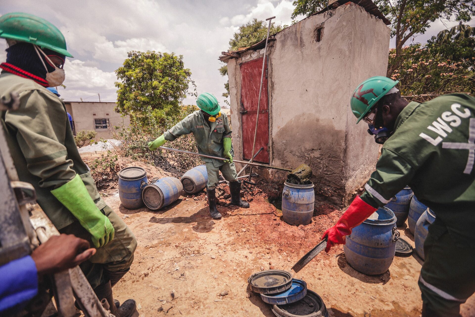 Emptying a pit latrine, Lusaka, Zambia