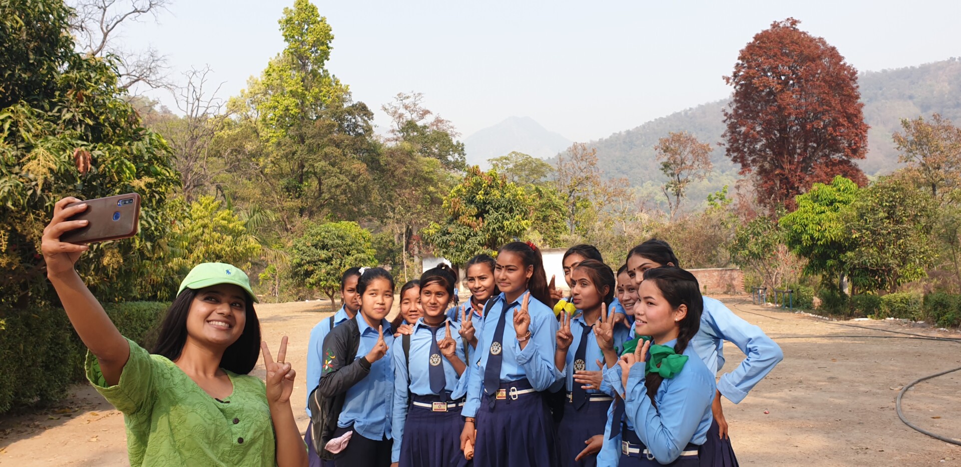 Keki Adikhari, actress and menstrual health ambassador, with schoolgirls in Dhangadhi