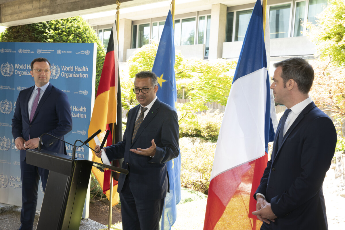 WHO Director-General, Dr Tedros Adhanom Ghebreyesus (middle) with Jens Spahn (left), Federal Minister of Health, Germany and Olivier Veran (right), Minister for Solidarity and Health, France, during a meeting for ministers of health in June 2020