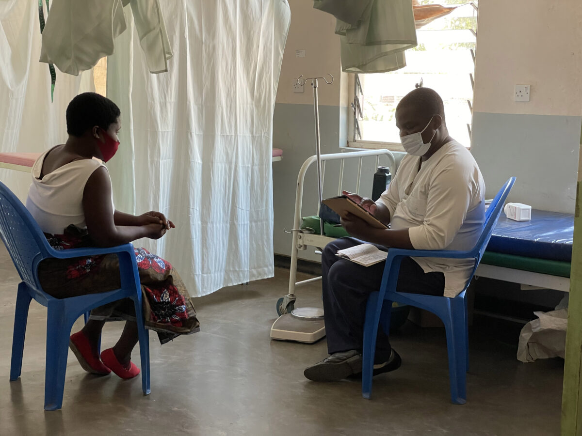 Health worker using tablet for consultation