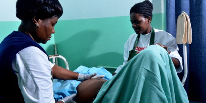 Nurses check expectant mother in Kisumu clinic