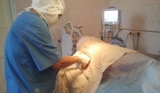 Dr Almaz Asymbaev at work in the operating room at the regional hospital in Talas, Kyrgyzstan